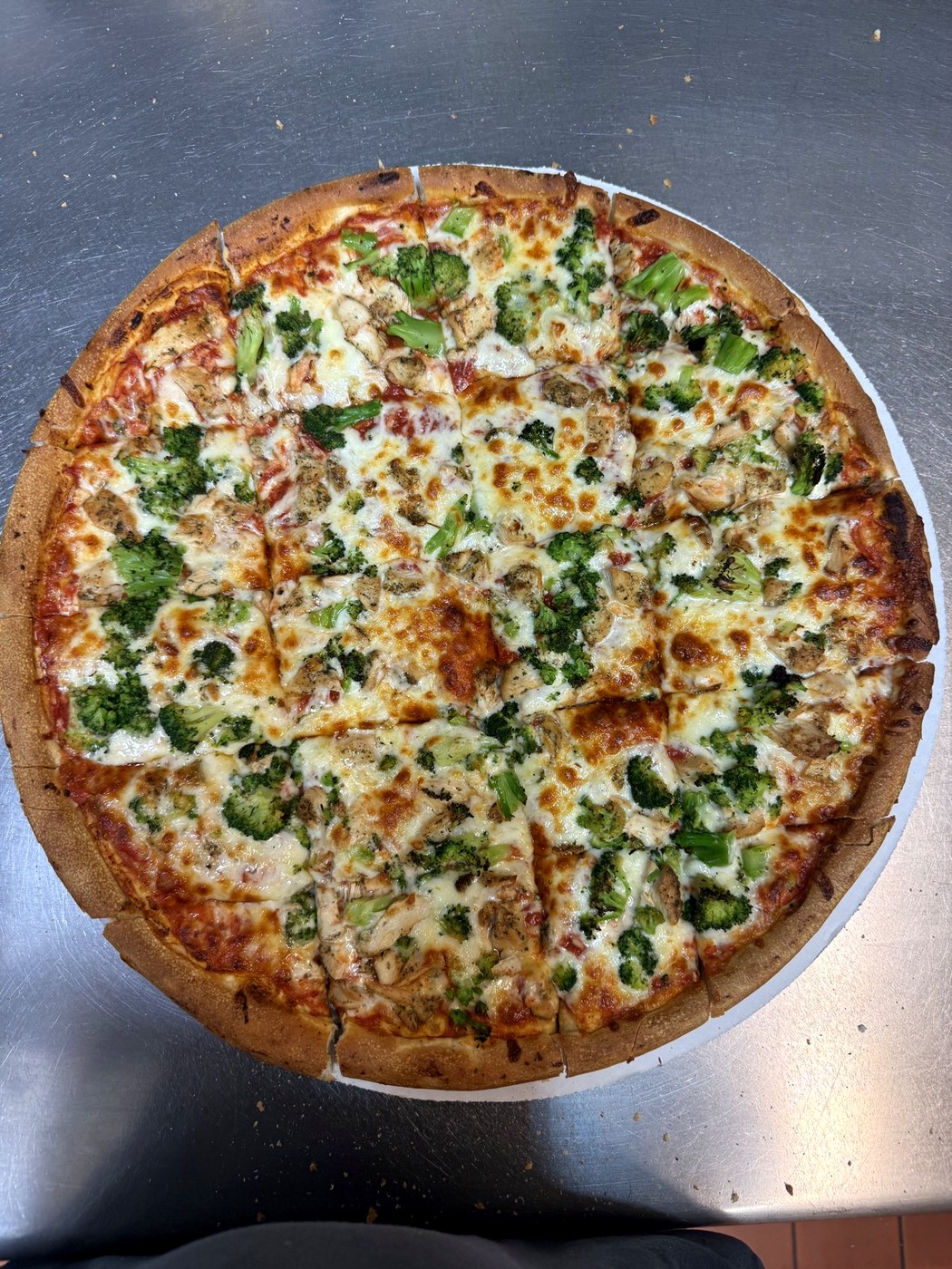 Chicken and broccoli pizza